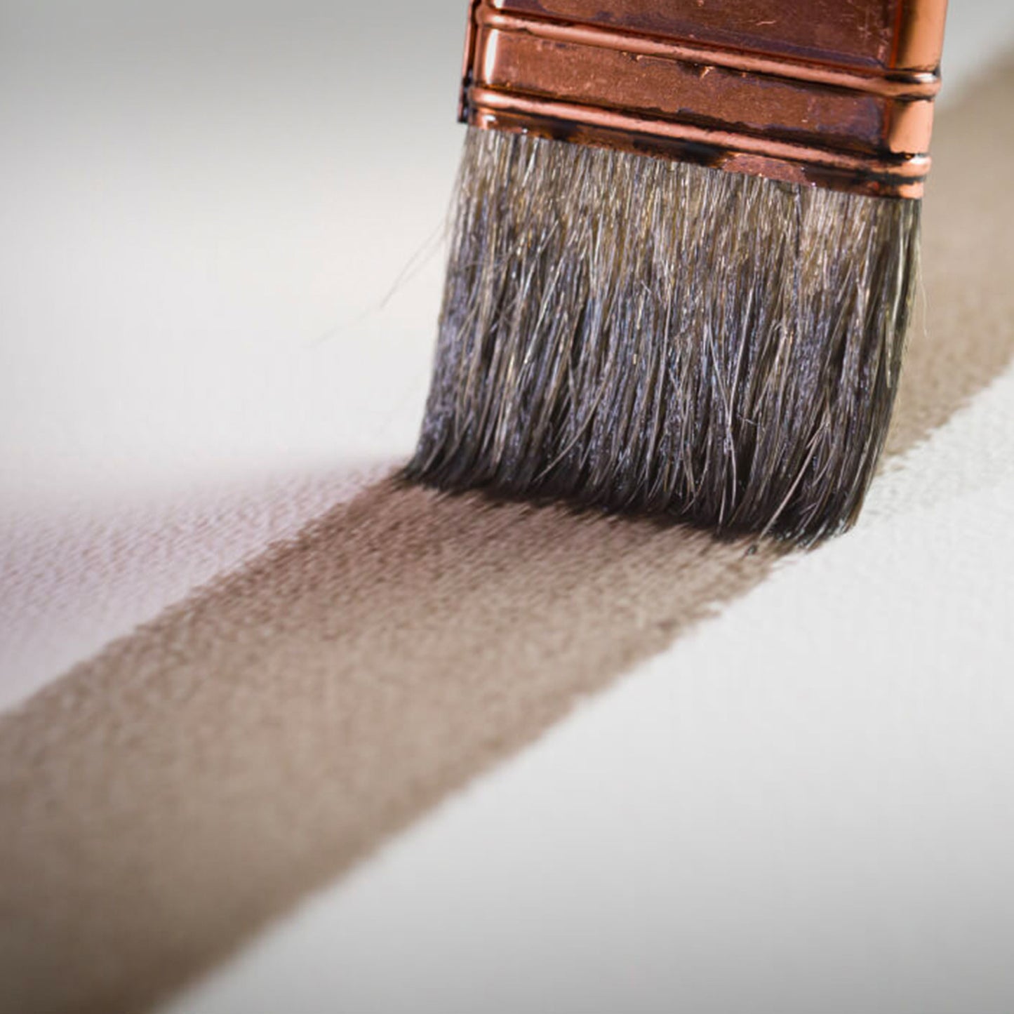 Close-up of Arches 300gsm watercolour in use with a dark tone watercolour wash to demonstrate the surface texture.