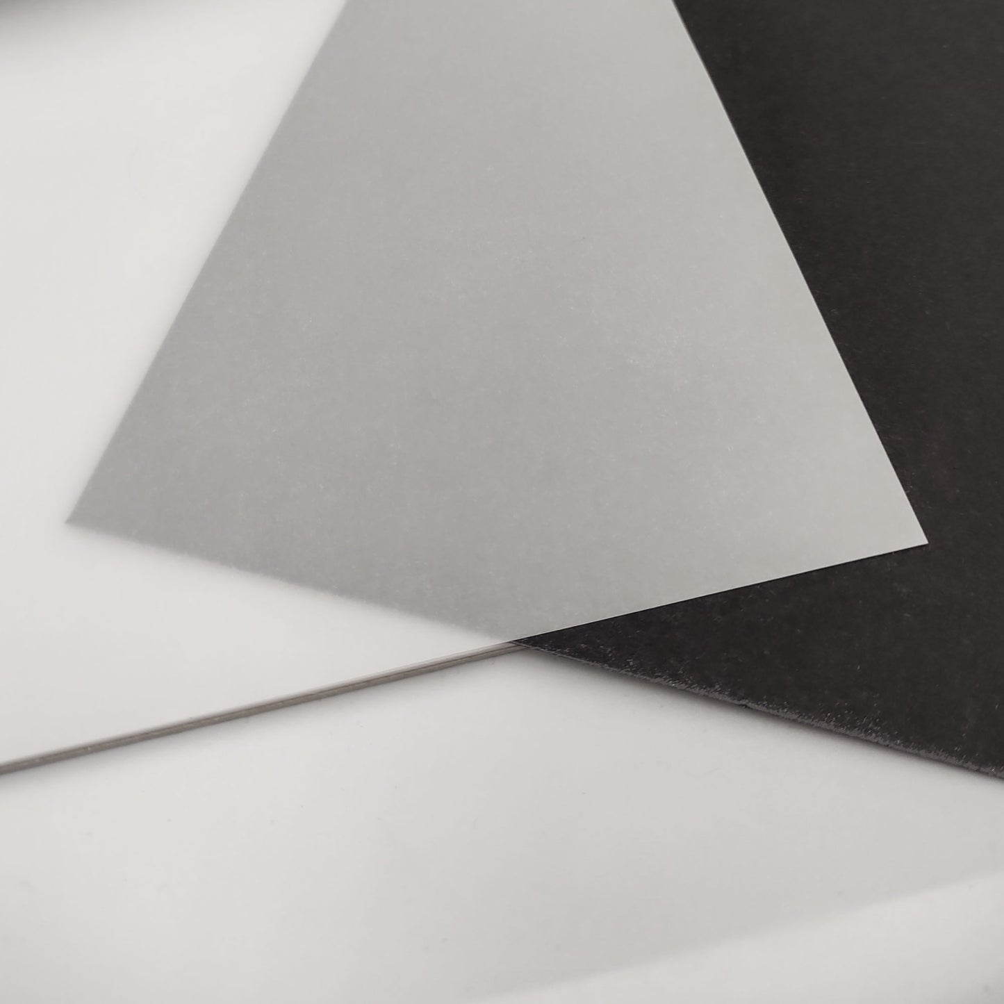 A demonstration of the paper's translucency using black card