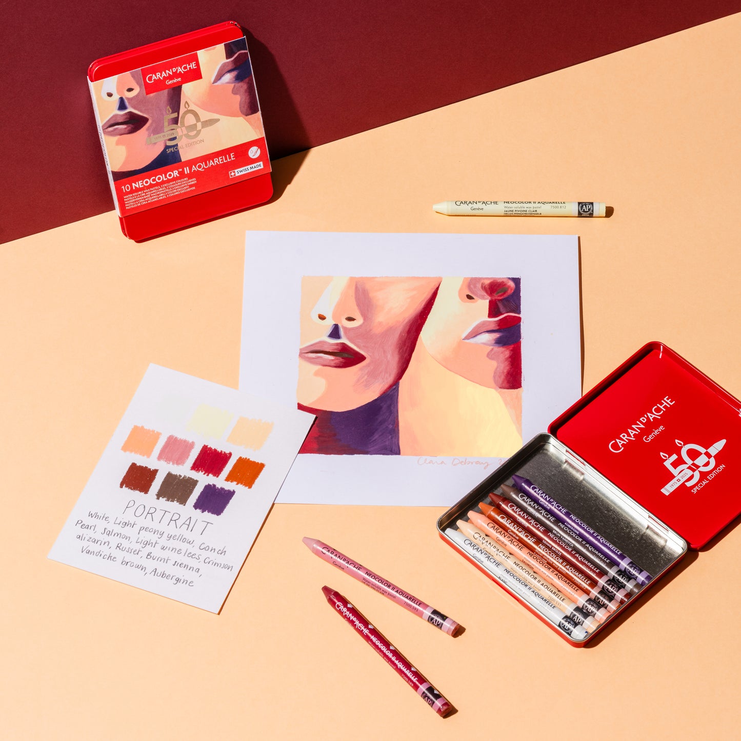 Crayon set with pencils, color swatches, and a drawing on a peach background