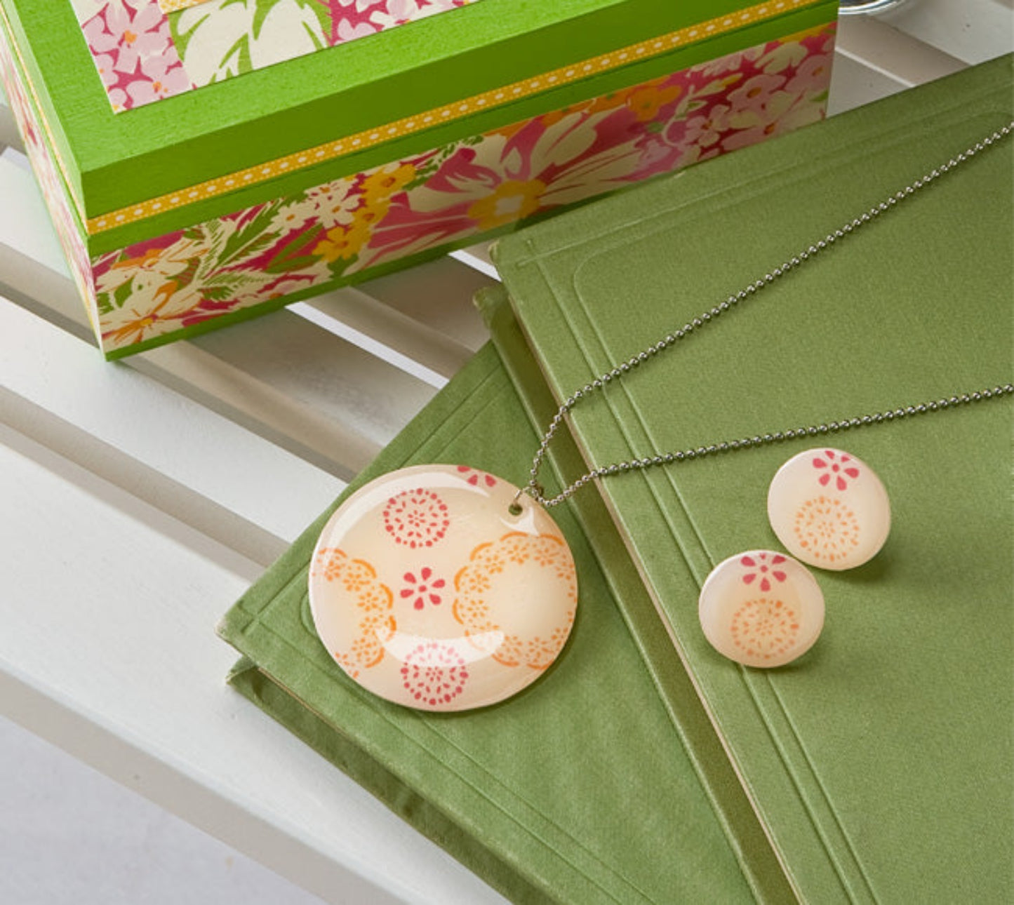 Mod Podge Gloss used to enhance the aesthetic of a ceramic, hippy-style necklace