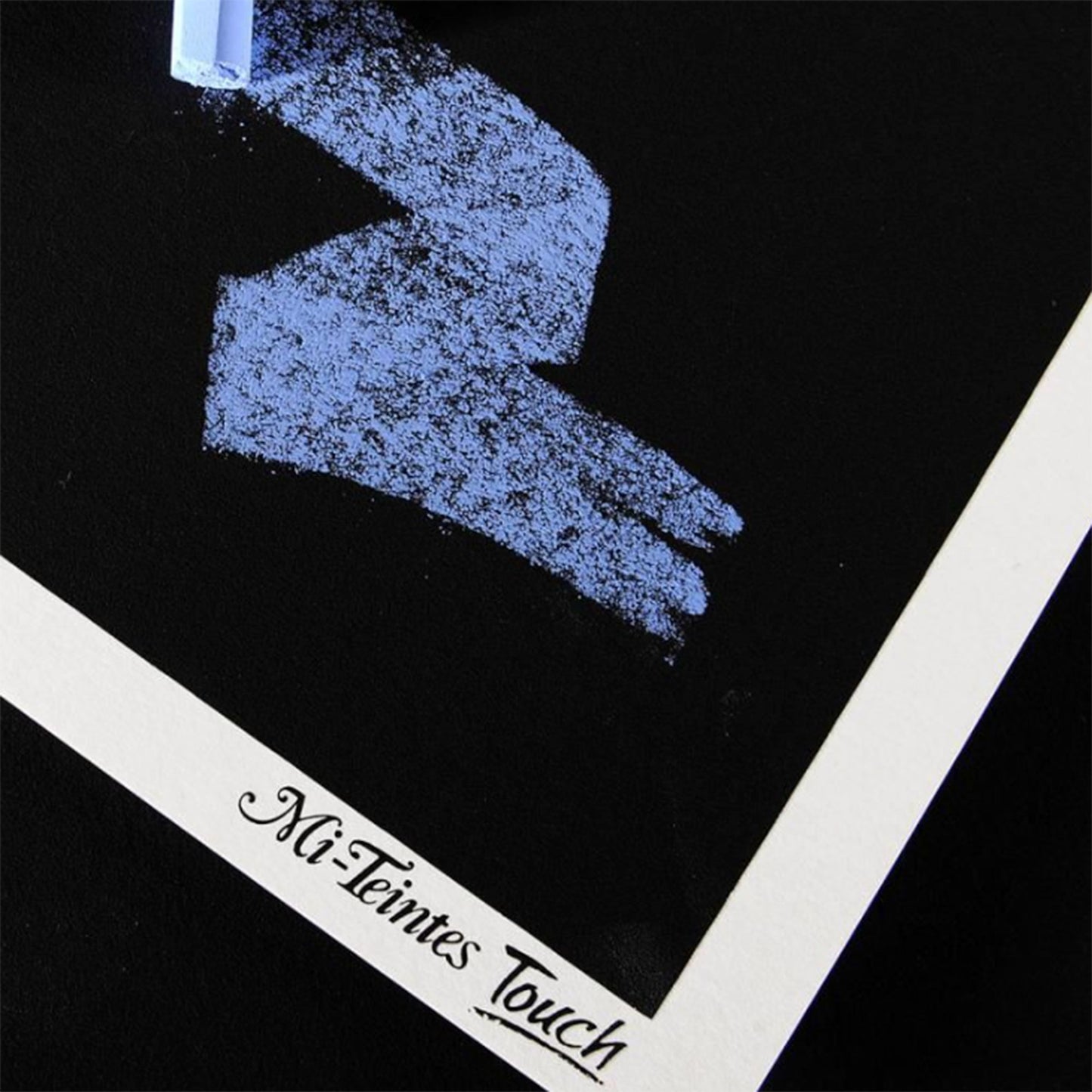 Canson Mi-Teintes Touch black colour sheet with blue pastel drawing details on textured paper.