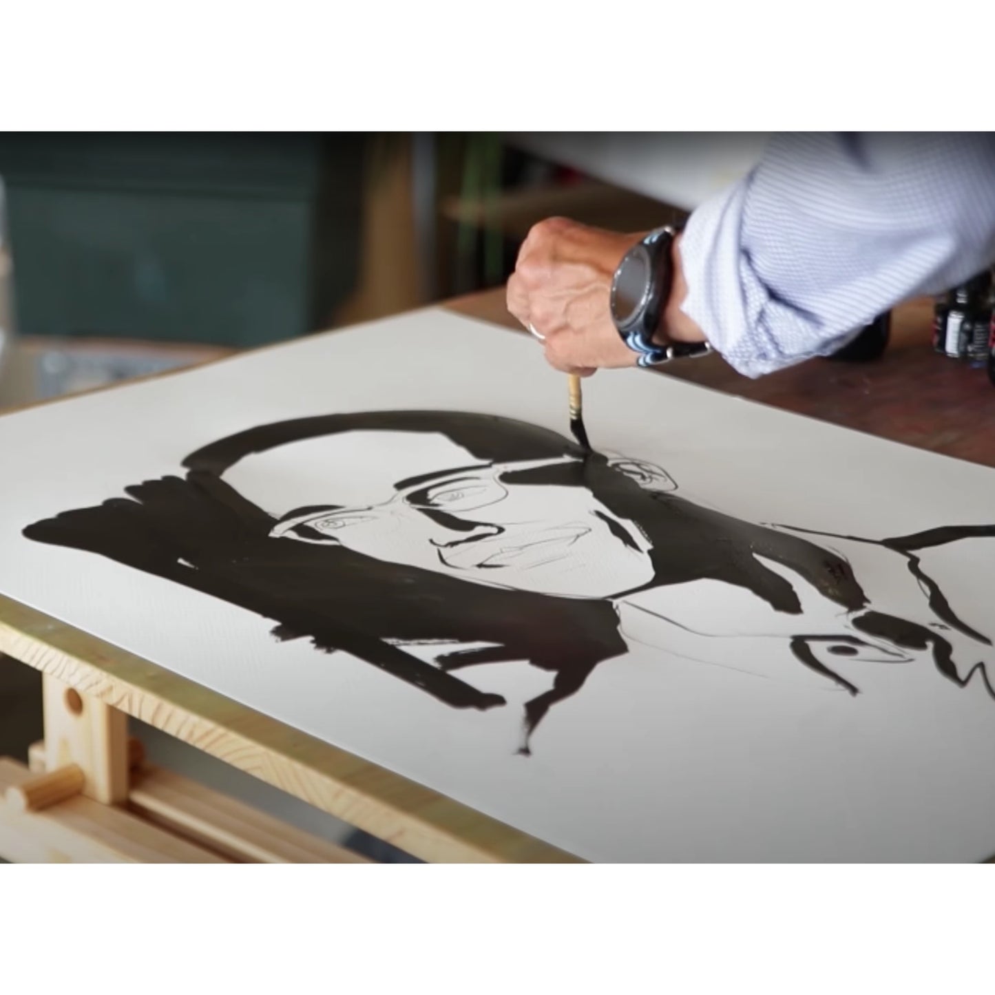 Demonstrative painting of a portrait using Sennelier Indian ink.