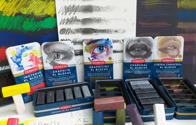 a selection of Derwent products including Inktense XL blocks, Graphite XL Blocks, Graphite XL Blocks, Charcoal XL Blocks and Tinted Charcoal XL blocks.