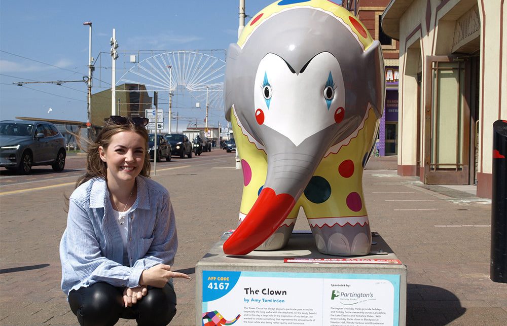 Amy Tomlinson, Blackpool based artist stood next to her painted elephant sculpture entitled  'The Clown'.   