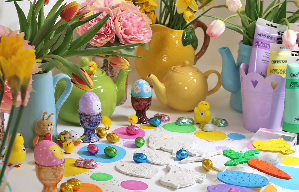 An Easter image with Tea pots and flowers and painted Easter Eggs.