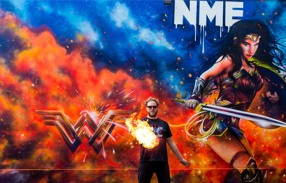 Artist Jim Vision stood in front of one of his large scale murals of Wonder Woman