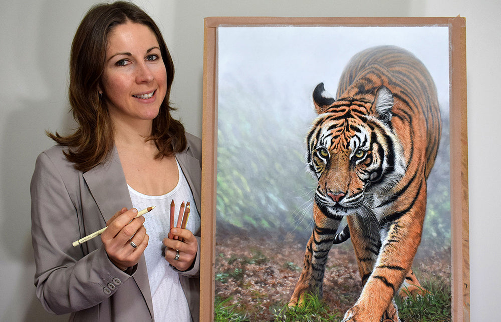 Artist Naomi Jenkins stood in front of her painting of a tiger.