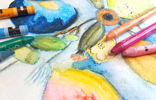 Caran d'Ache Neocolor II Aquarelle - Water-Soluble Wax Pastels laid out over a pastel painting inspired by Odilon Redon