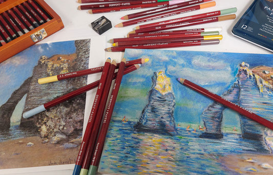 Derwent pastel pencils laid out on top of a pastel drawing inspired by Claude Monet. 