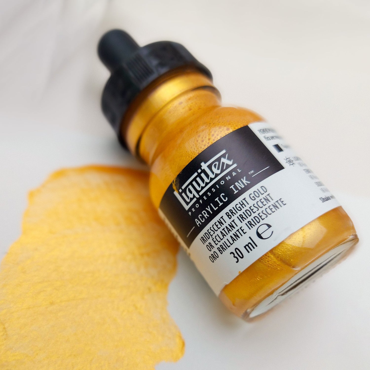 A banner image featuring Liquitex Metallic Gold Acrylic Ink