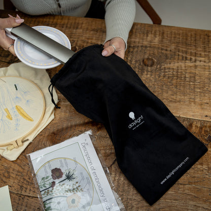 Daylight Halo Go 2 Lamp being placed into the included carry bag