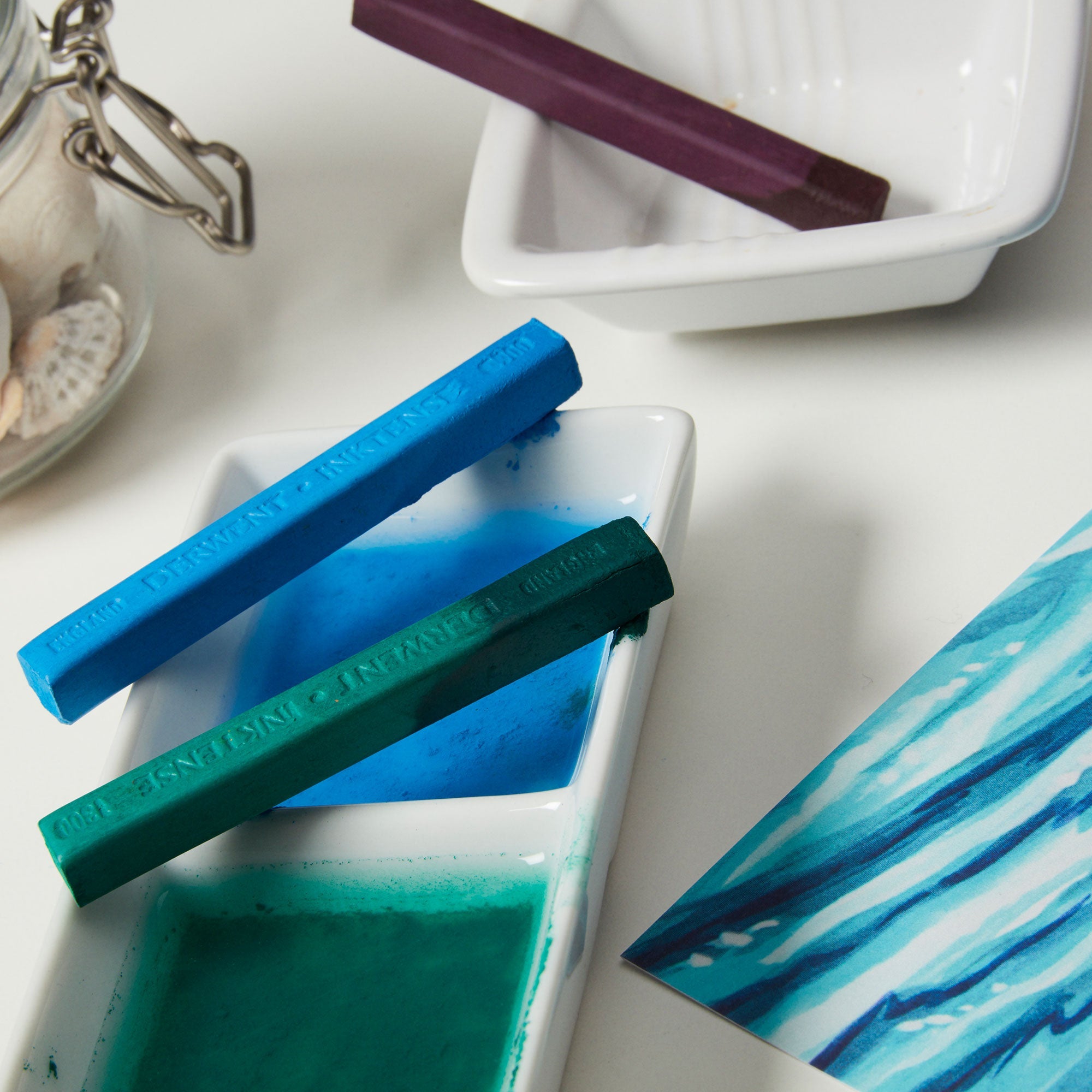 Vibrant strokes of ink-like colour in a solid, richly pigmented block.