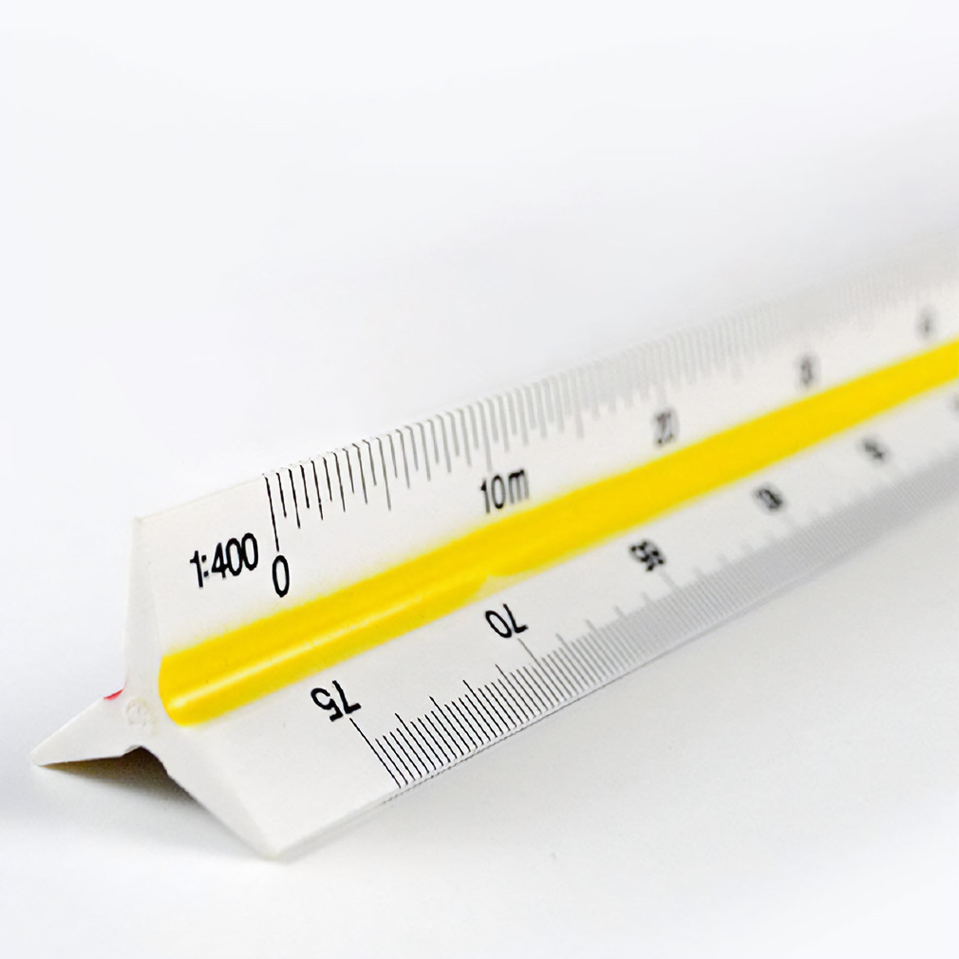 Close-up shot of the ruler showing some of the metric scale markings on 2 of the 6 sides.