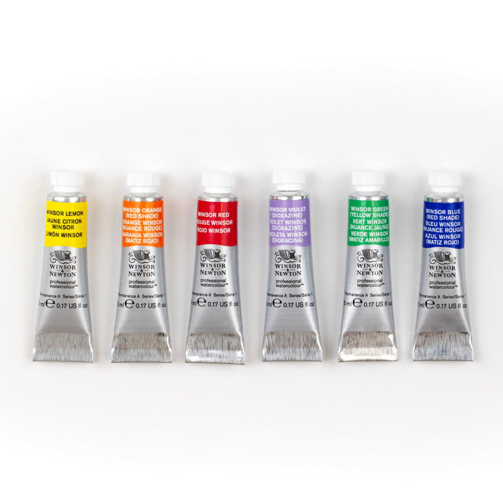 Six tubes of Newton brand watercolor paint arranged in a row on a white background, showing the color labels: yellow, orange, red, purple, green, and blue.