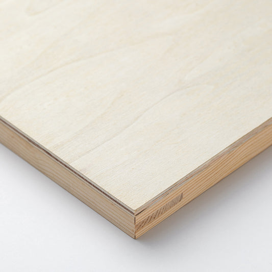 Close-up of a wooden frame with a quilted mattress corner on a white background
